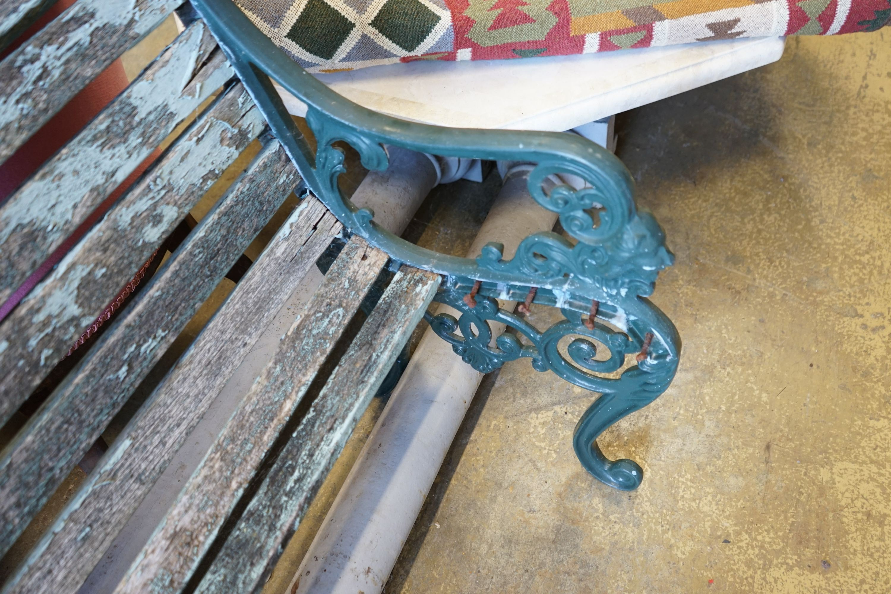 A painted aluminium slatted garden bench, in need of restoration, width 125cm